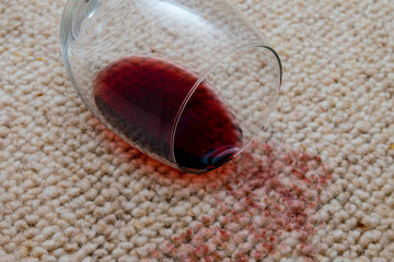 Glass of wine spilled on carpet