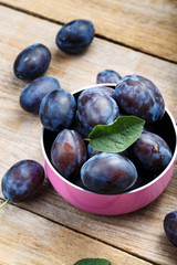 ripe plums in a bowl