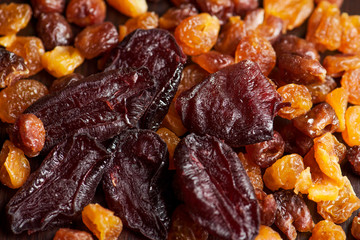 Close up dried fruits, plum and cherry. Sweet background. 