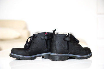  closeup black autumn boots with laces for boys