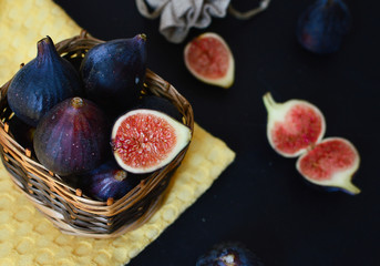Fresh figs in a wooden basket. The concept of diet, healthy eating.