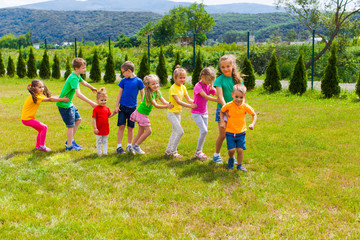 Obraz premium Kids have fun outdoors, friendship and teamwork concept