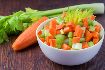Fresh salad from stalks of celery, carrots, apples and cheese. Fitness breakfast, healthy.