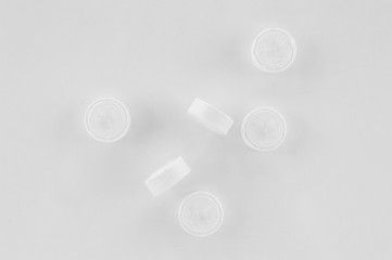 Compressed, dry, biodegradable coin tissues on a white background. Tablet tissues in practical and compact pill form.