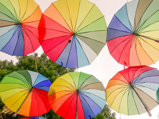 many colorful umbrella in the air