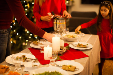 Burning candles on the holiday table. Merry Christmas and Happy Holidays.