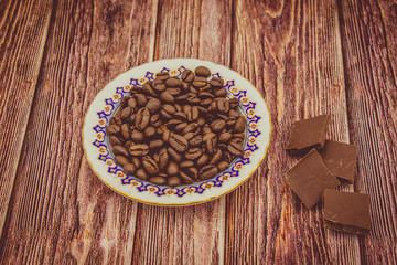 a full plate of coffee beans on a wooden table