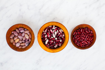 Mix of kidney beans in wooden bowls
