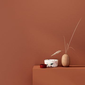 Interior decoration with vases  on a background of a teracotta wall