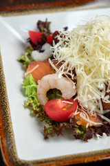 Salad with lettuce and prawns. Restaurant menu
