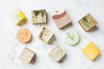 top view of various handcrafted soap with different ingredients
