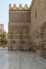 Outer wall of public historic Al Hakim Mosque known as The Enlightened Mosque, located in Moez Street, Old Cairo, Egypt