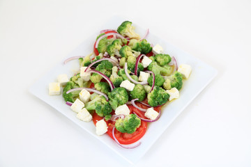 Broccoli salad with tomatoes and cheese