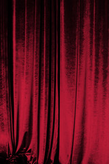 Red curtain of luxurious velvet on the theater stage. Copy space. The concept of music and...