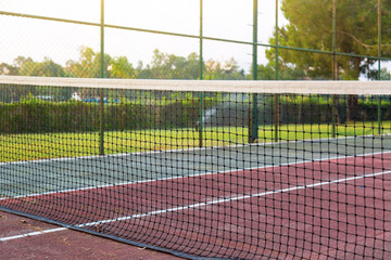 Sports ground, tennis court at the hotel. A net stretched on a tennis court, a sports ground of a Turkish hotel.