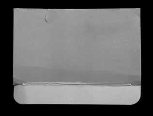 pieces of torn paper texture on black background, copy space.