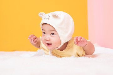 Happy newborn cute baby in studio