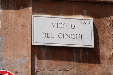 Street sign on marble plate:  vicolo del cinque, Rome, Italy