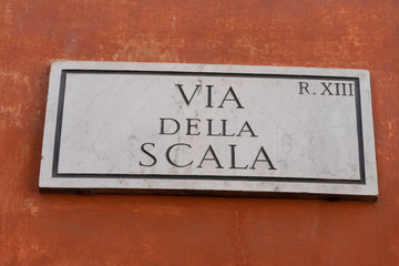 Fototapeta premium Street sign on marble plate: Via della Scala, Rome, Italy