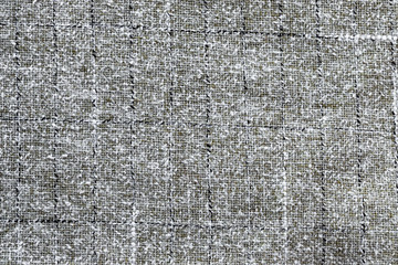 Background in the form of a gray-white wool product with vertical and horizontal lines