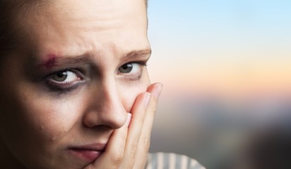 Young woman crying on background