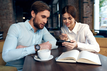 young couple having breakfast in cafe