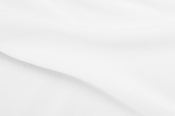 White fabric texture background with soft waves.