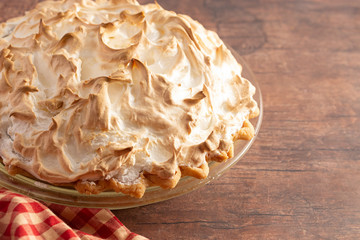 Chocolate Meringue Pie on a Rustic Wooden Table