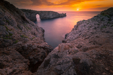 Fototapeta na wymiar Famous Pont d'en Gil at the west coast of Menorca, Balearic Islands, Spain.