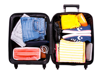 packed suitcase over white background
