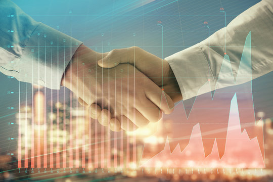 Double exposure of financial chart on cityscape background with two businessmen handshake. Concept of financial analysis and investment opportunities - Powered by Adobe