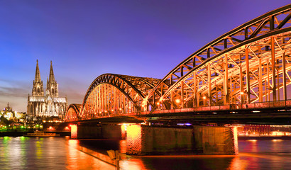 Fototapeta premium Cologne Cathedral and Hohenzollern Bridge at twilight , Cologne, Germany