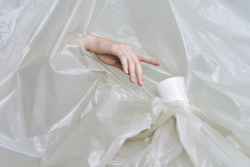 hands holding plastic