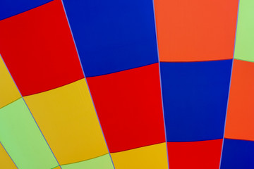 Colorful bright pattern on a large inflated balloon in the sky. Background. Close-up.
