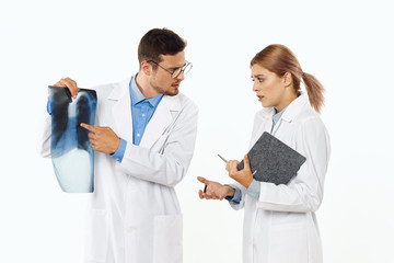 two doctors looking at an xray