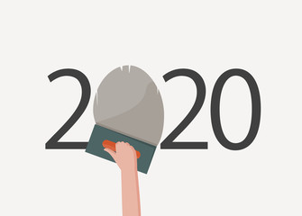 happy new year 2020. 2020 with hand holding a trowel plastering