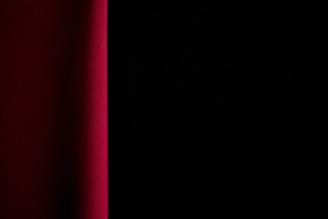 Two colors red and black luxury background or concept, folds of red and black fabric