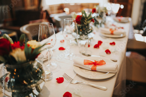 Wedding Table Setting Decorated With Fresh Flowers And Silverware