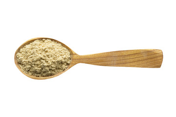 powdered ginger in wooden spoon isolated on white background. spice for cooking food, top view.