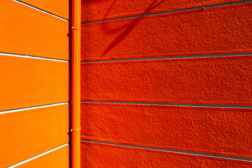 Orange painted corner of building