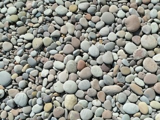 Pebbles on the beach background