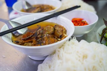 Bun Cha with grilled pork, rice noodles, vegetable and soup in vietnamese cuisine and street foods on VIETNAM HANOI
