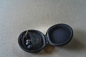 Mini cases for safe transport headphones on the floor