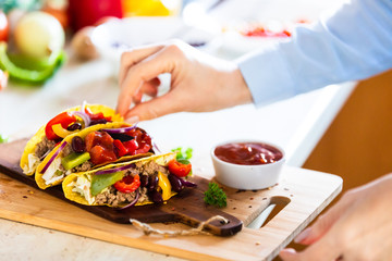 Tacos on cutting board