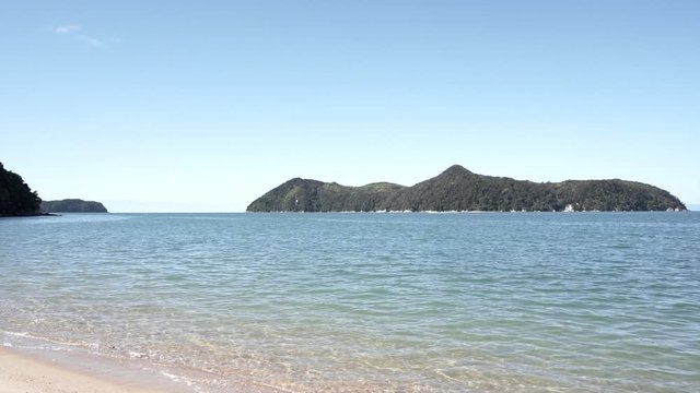 amazing view of quiet seashore and rocks in abel tasman 