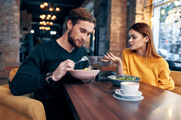 young couple drinking coffee in cafe