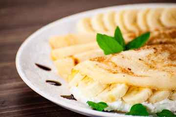Crepes with bananas and cream