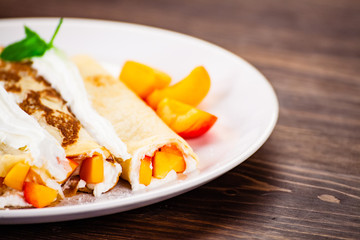 Sweet crepes with apricots