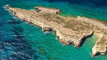 Aerial drone photo of small islet of Glaronisi with paradise emerald clear sea rocky beaches, Koufonisi island, Small Cyclades, Greece