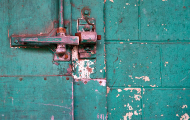 rusty metal handle to old warehouse door